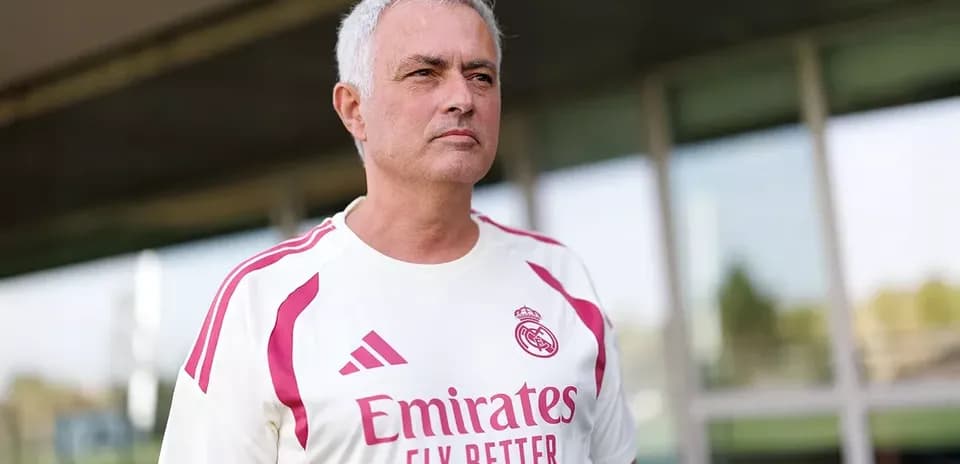 Football coach wearing Real Madrid training kit