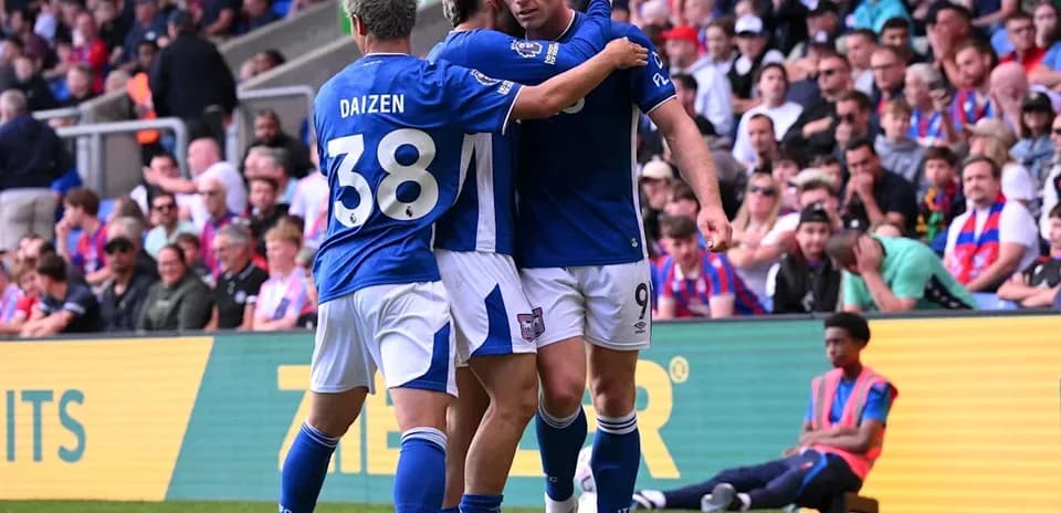 Players celebrating a goal on the pitch