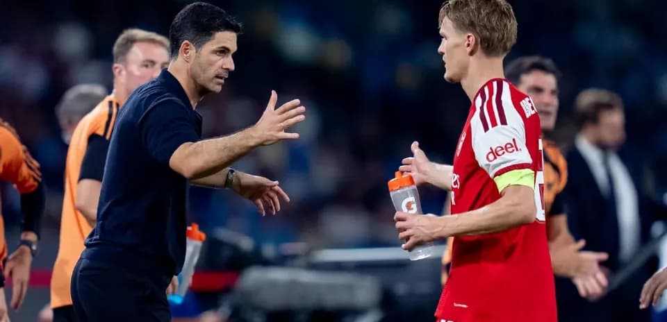 Coach discussing with player during match substitution