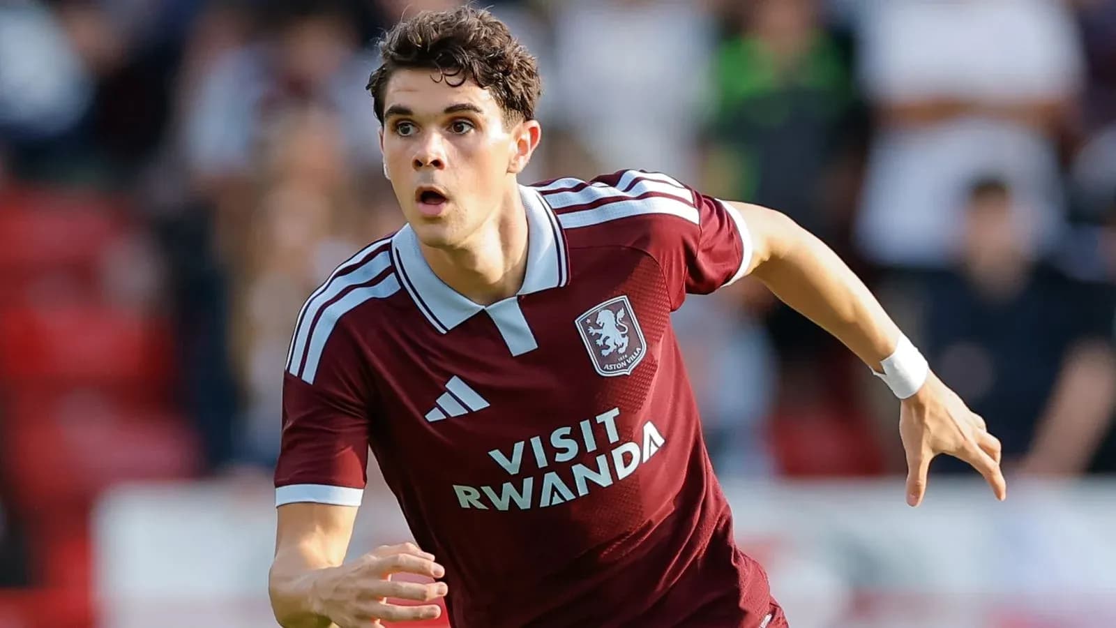 Aston Villa player running during a match