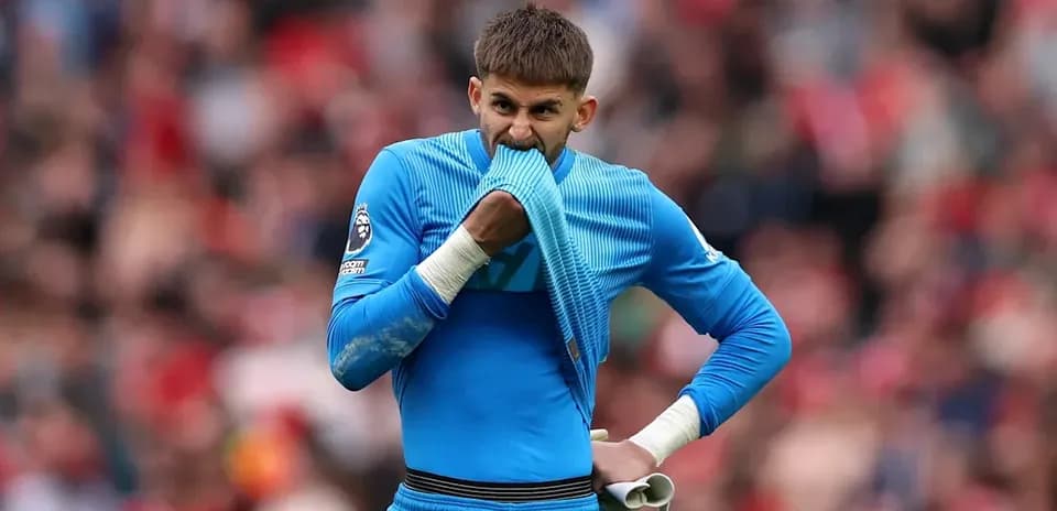 Goalkeeper biting jersey during a match