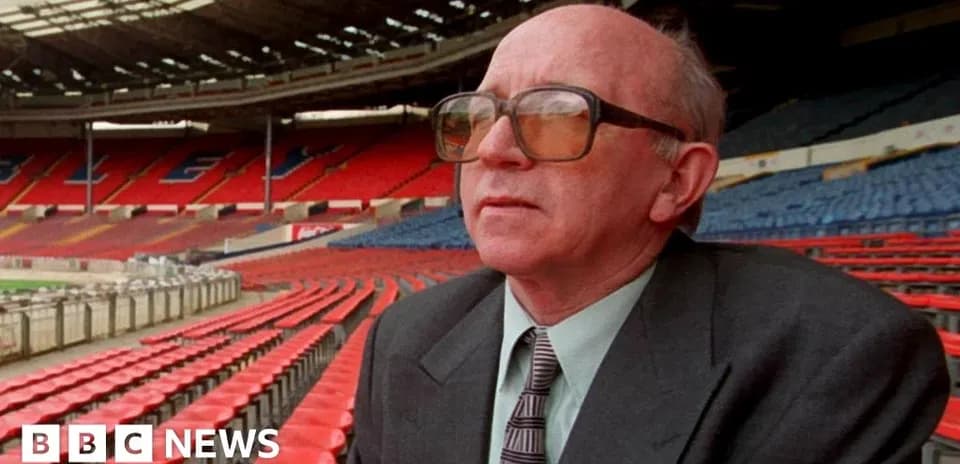 Man sitting in empty stadium seats