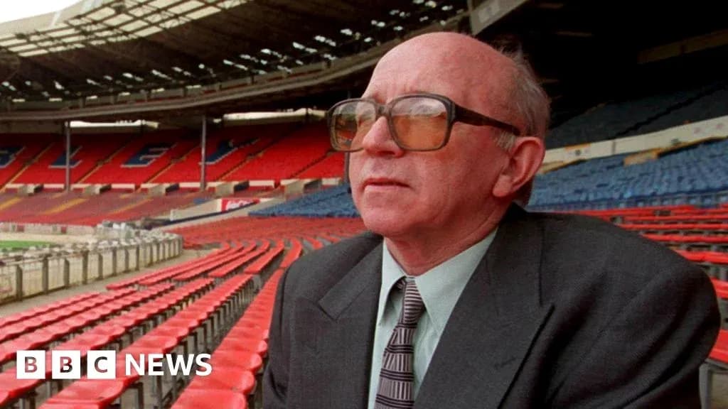Man sitting in empty stadium seats