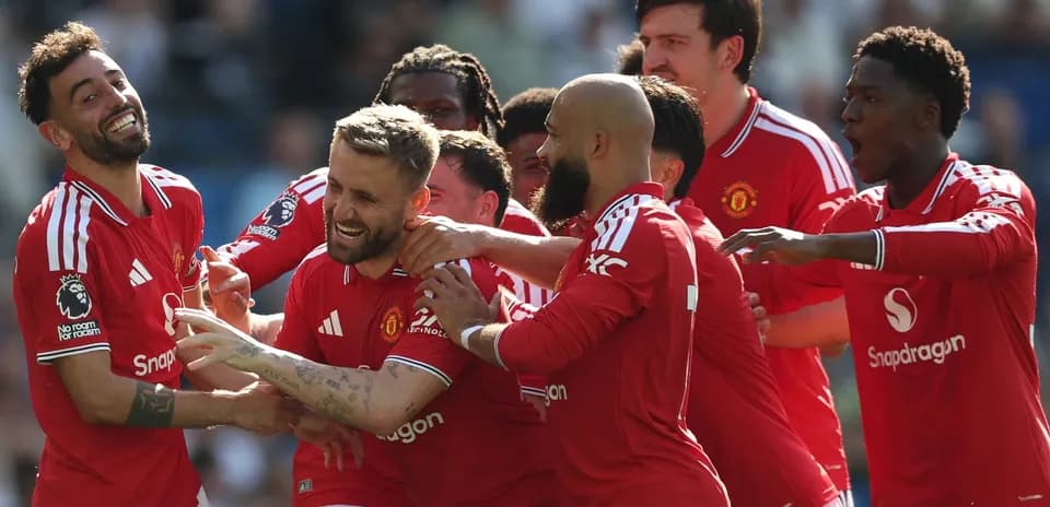 Manchester United players celebrating a goal together