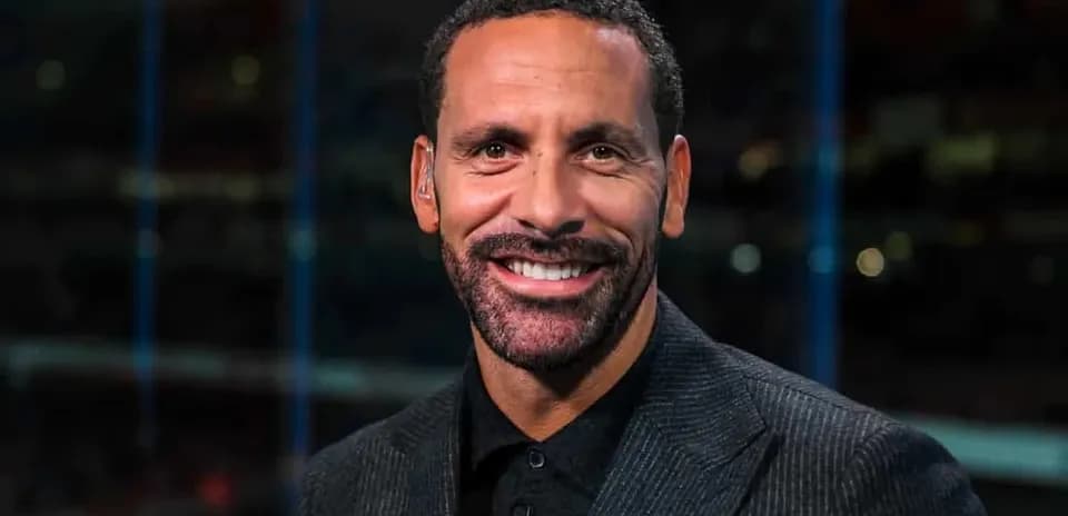 Analyst smiling in studio during broadcast