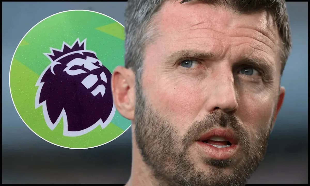 Coach speaking with Premier League logo in background