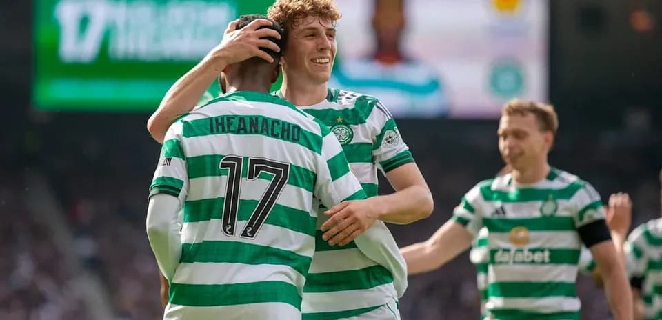 Celtic players celebrating a goal on the field