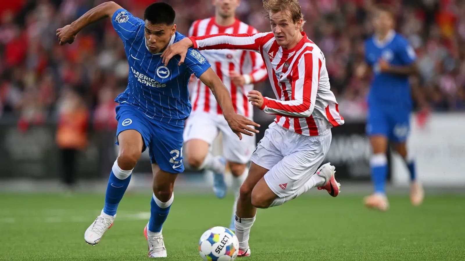 Two players competing for the ball during match
