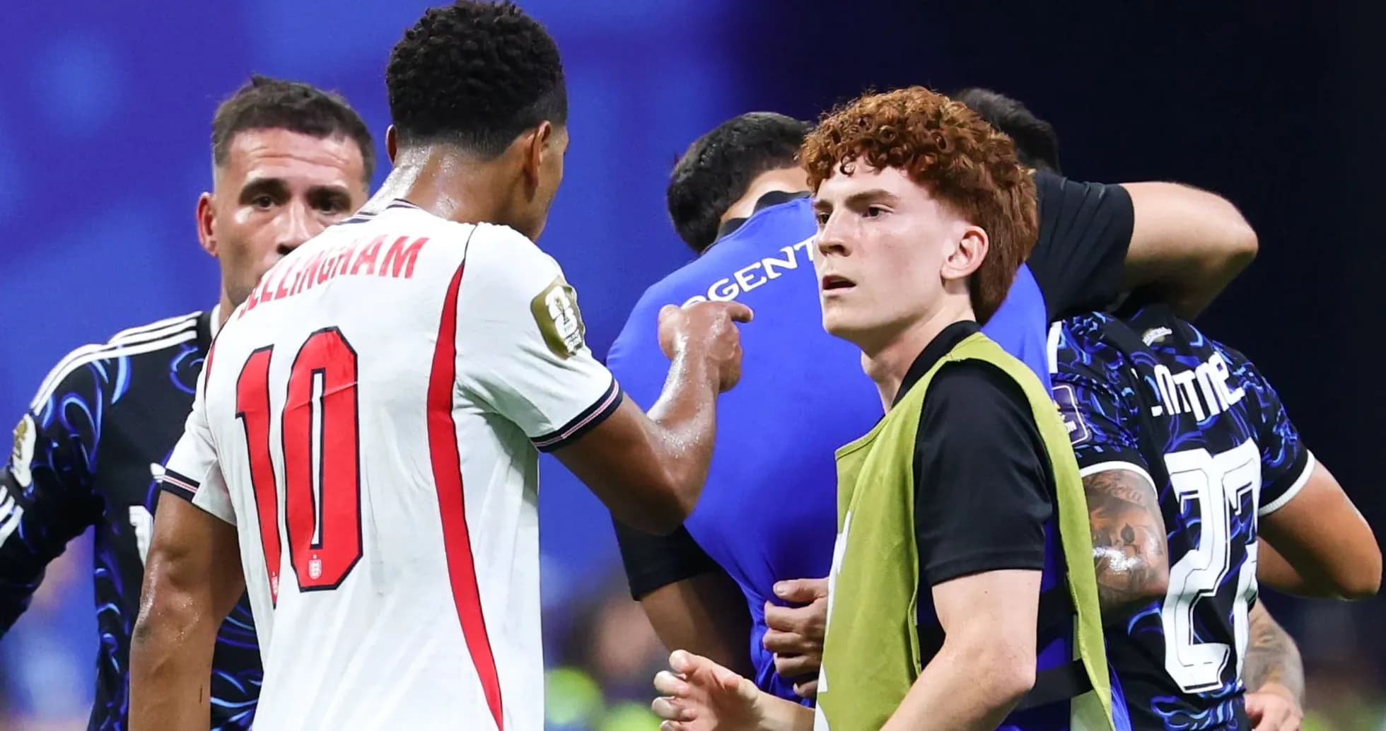 Players interacting during a tense moment on field