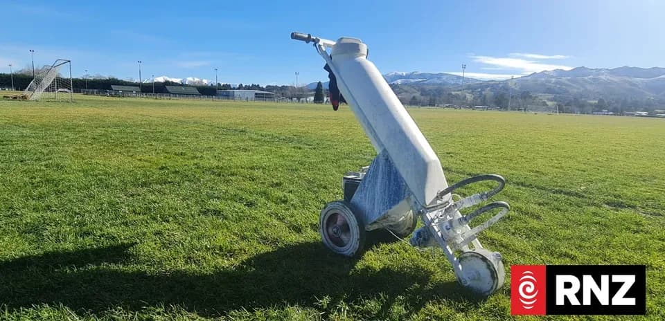 Line marking machine on a soccer field