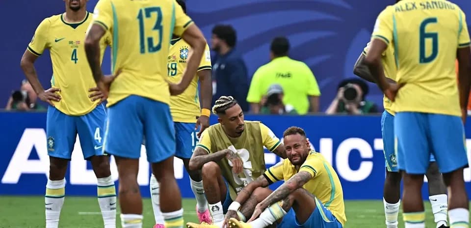 Brazilian players reacting to Neymar on the ground