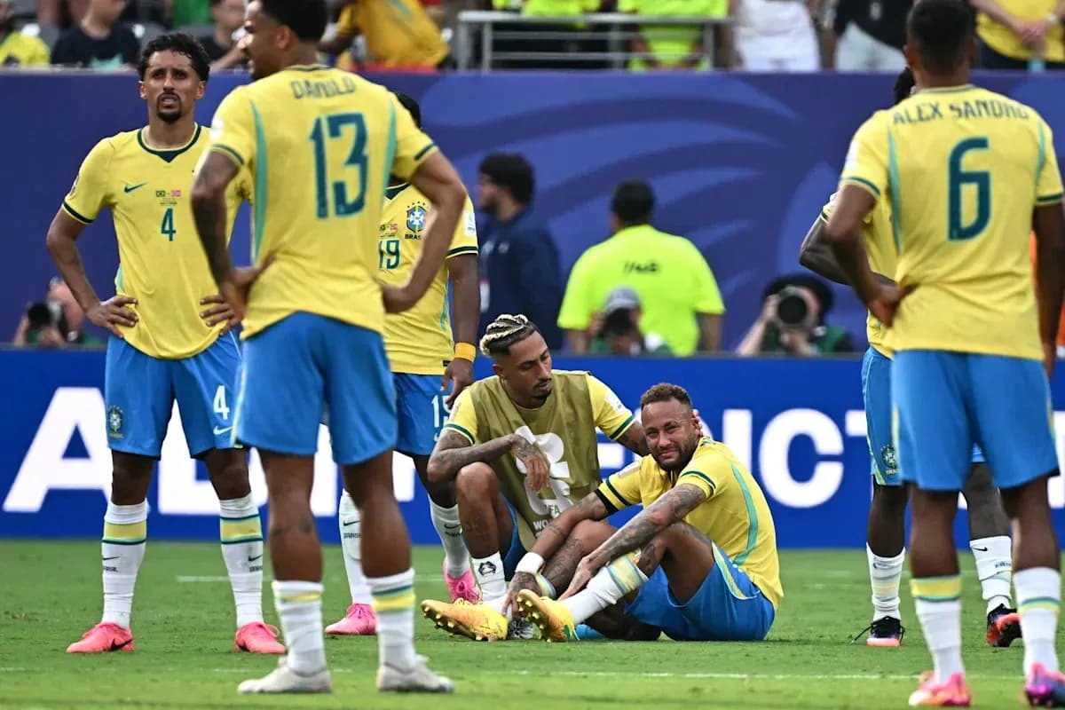 Brazilian players reacting to Neymar on the ground