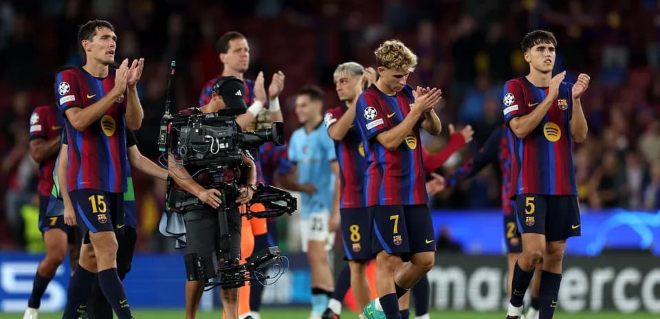 Barcelona players applauding fans after the match