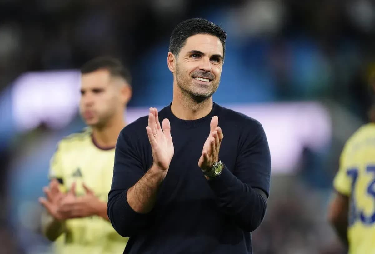 Men's football coach applauding after the match