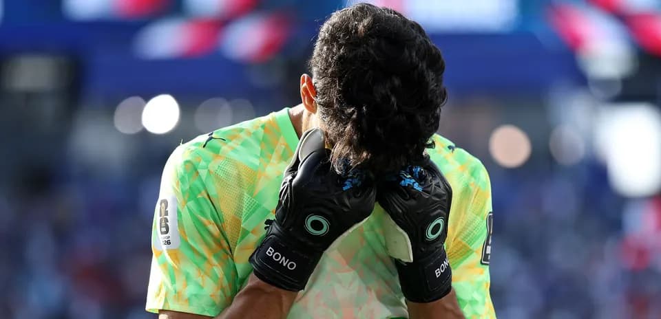 Goalkeeper with hands on head during match