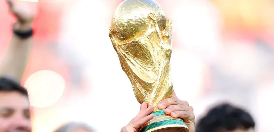World Cup trophy held aloft by fans