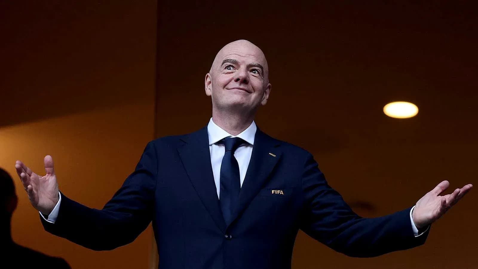 FIFA president speaking at event with open arms