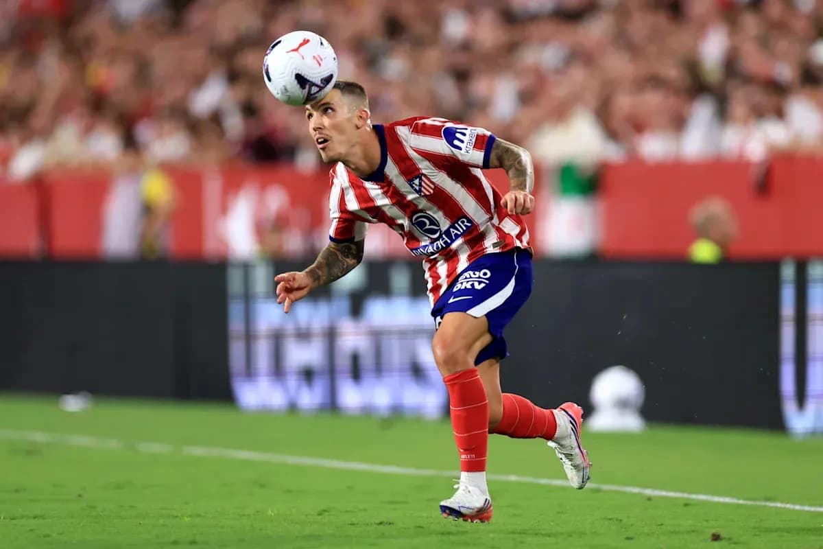 Atletico Madrid player heading the ball during match