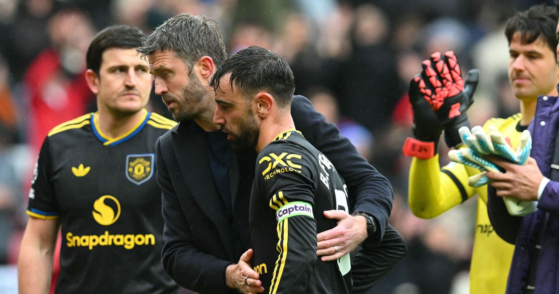 Bruno Fernandes receiving support from teammate after match