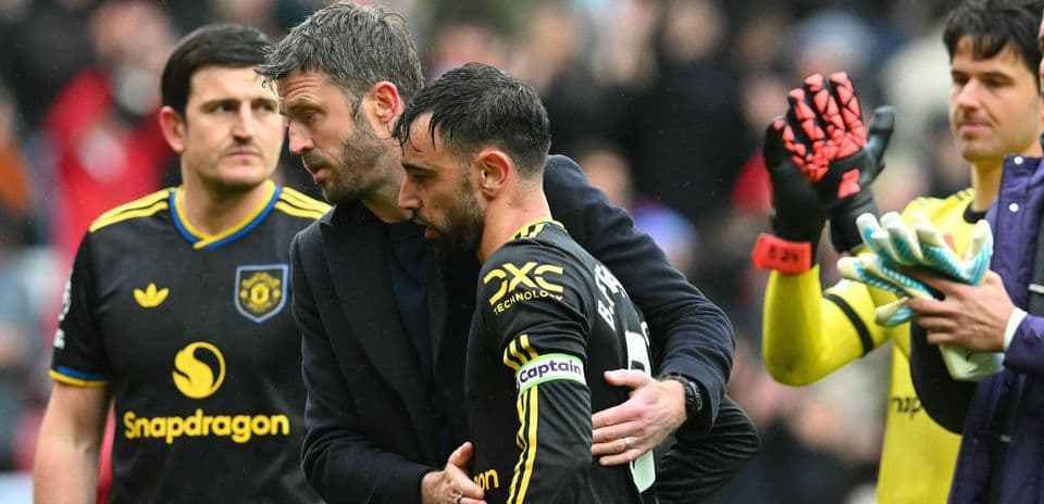 Bruno Fernandes receiving support from teammate after match