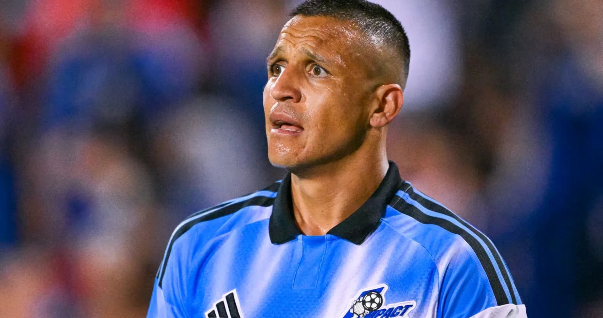 Referee in blue uniform during a soccer match