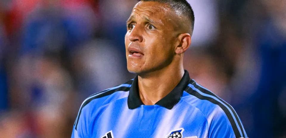 Referee in blue uniform during a soccer match