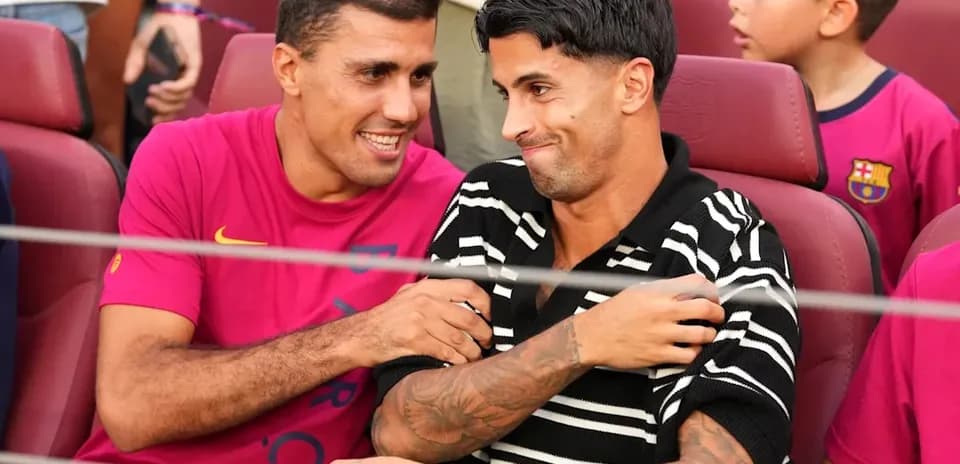 Two players interacting in seats at stadium