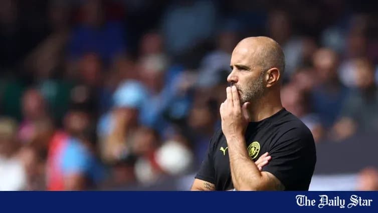 Men's football coach observing the match sidelines