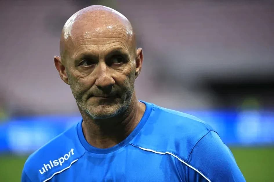 Coach wearing blue training kit on the field