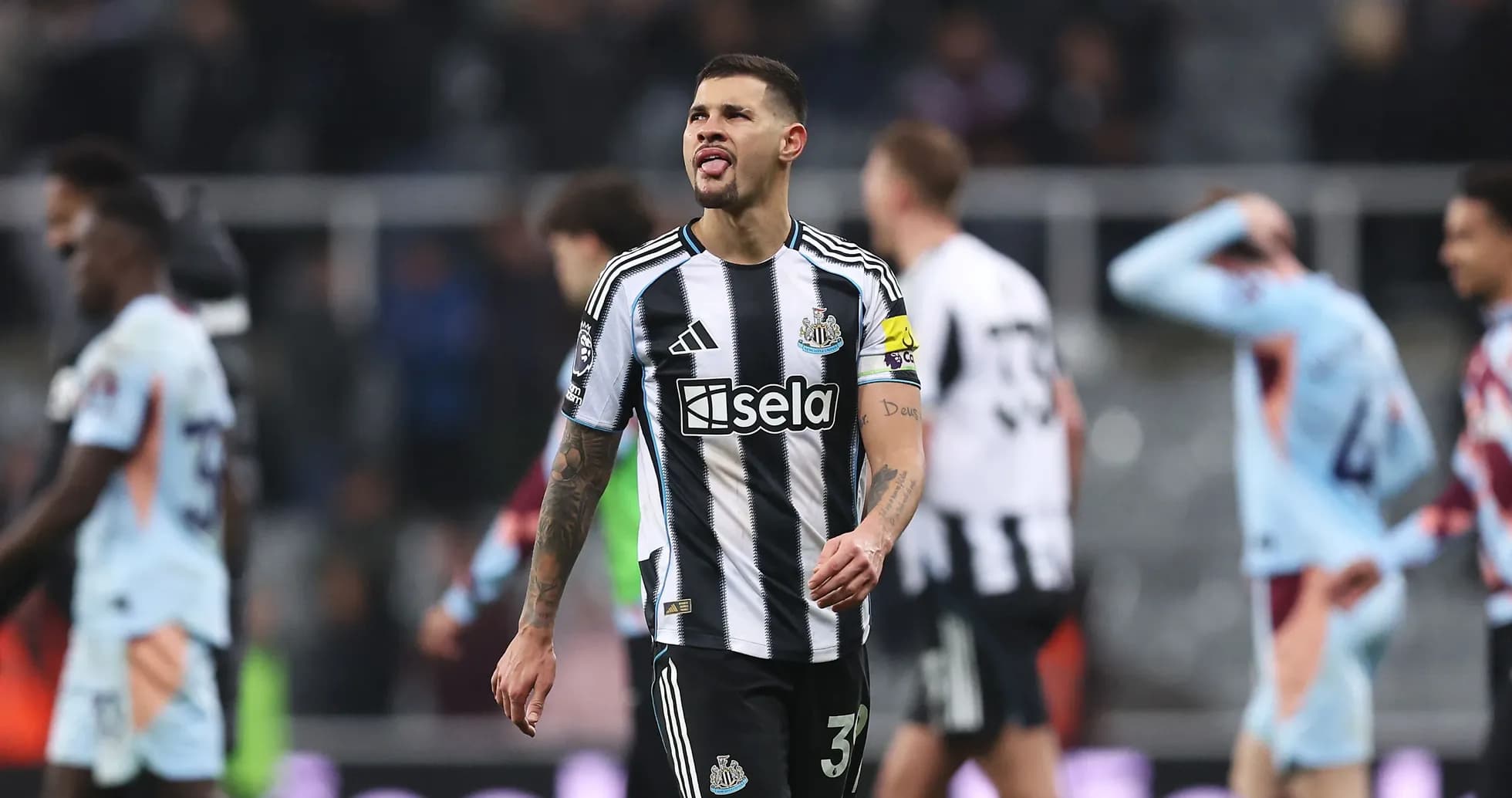 Newcastle player walking off pitch after match