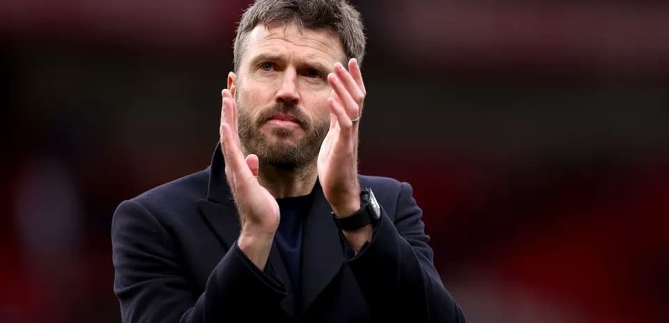 Coach applauding fans after match conclusion