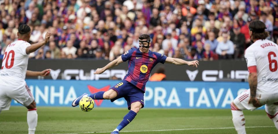 Robert Lewandowski kicking ball during match