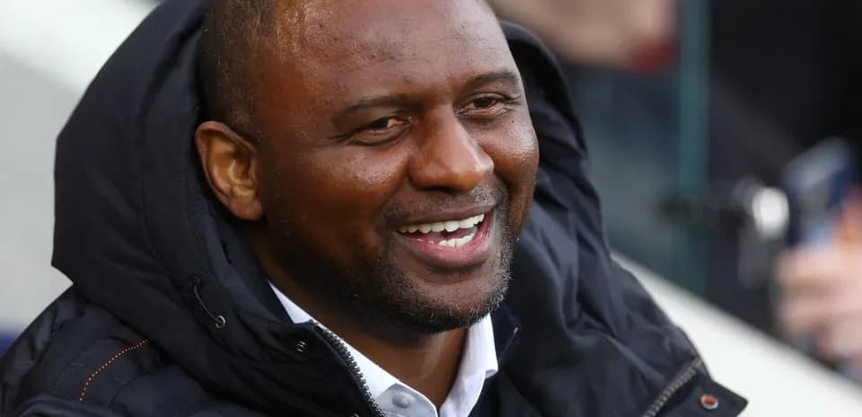 Patrick Vieira smiling in the stands during match