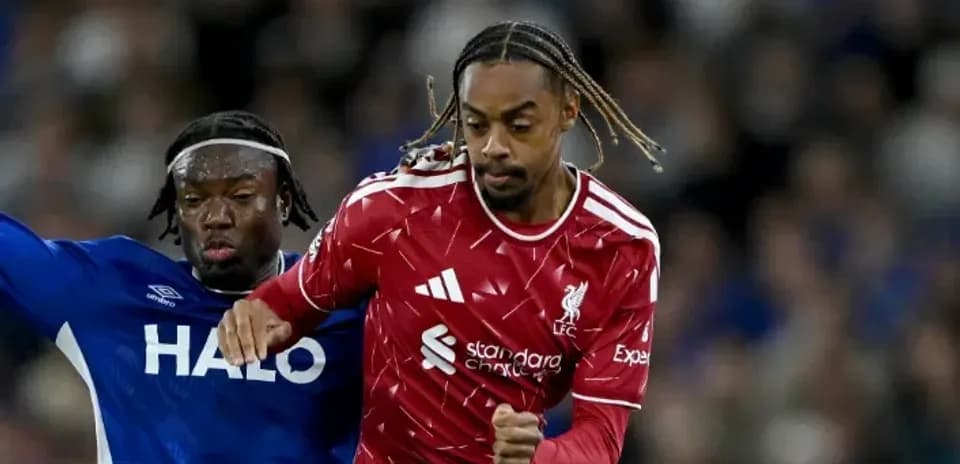 Liverpool player evading defender during match