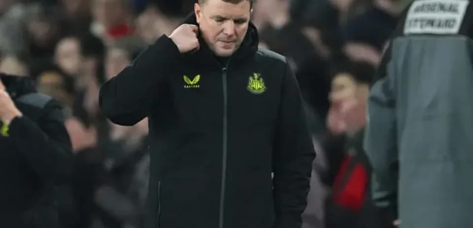 Manager walking off the pitch after match