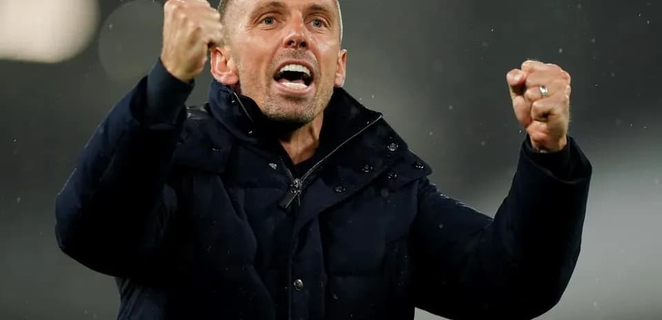Coach celebrating passionately during a match