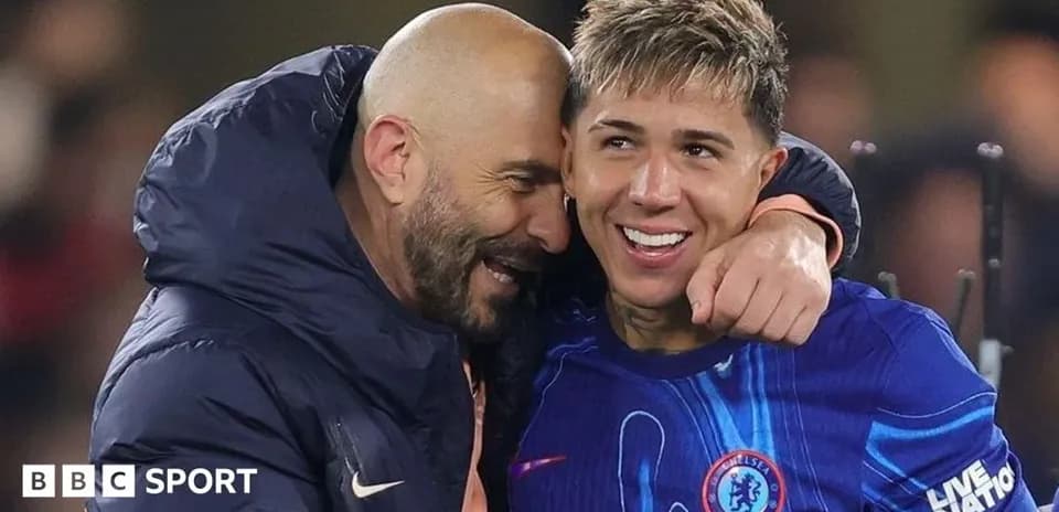 Two football players celebrating after a match