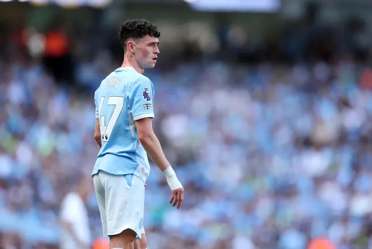 Phil Foden in Manchester City kit on the field