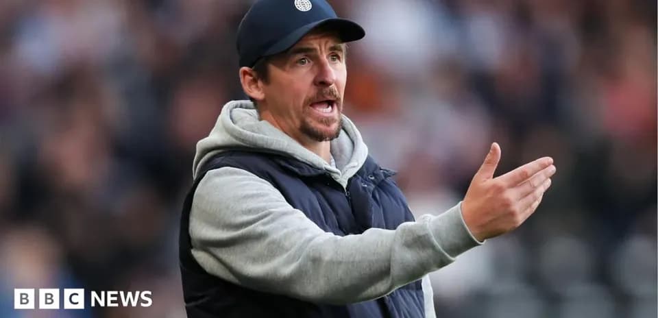 Coach giving instructions on the sidelines during match