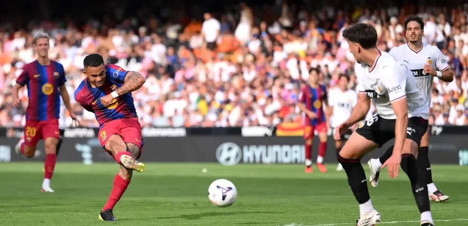 Barcelona player shooting the ball during match