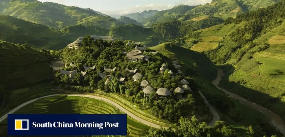 Aerial view of hillside village in lush landscape