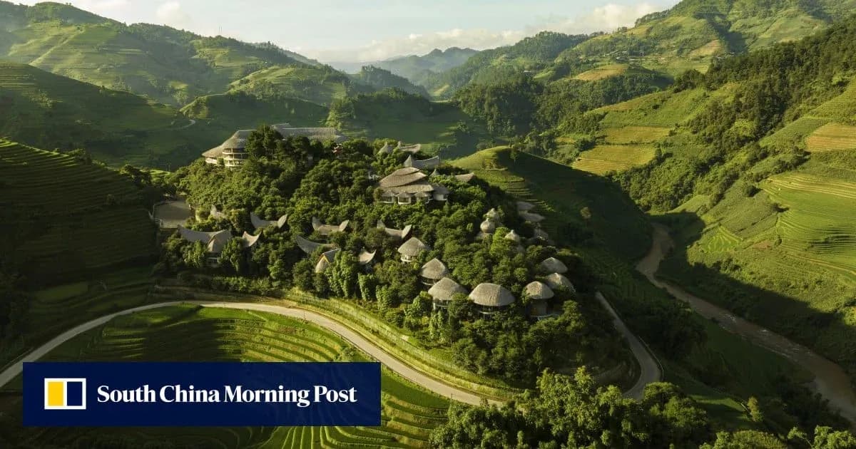 Aerial view of hillside village in lush landscape