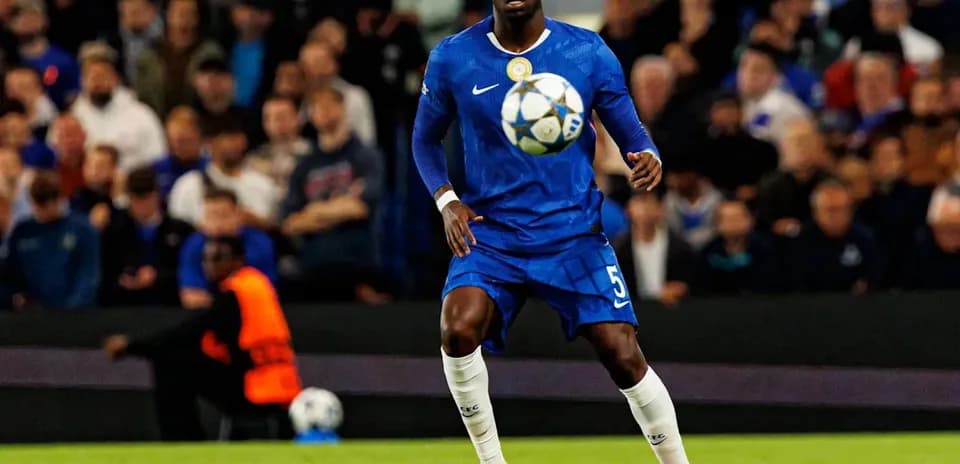 Player in blue jersey controlling ball during match