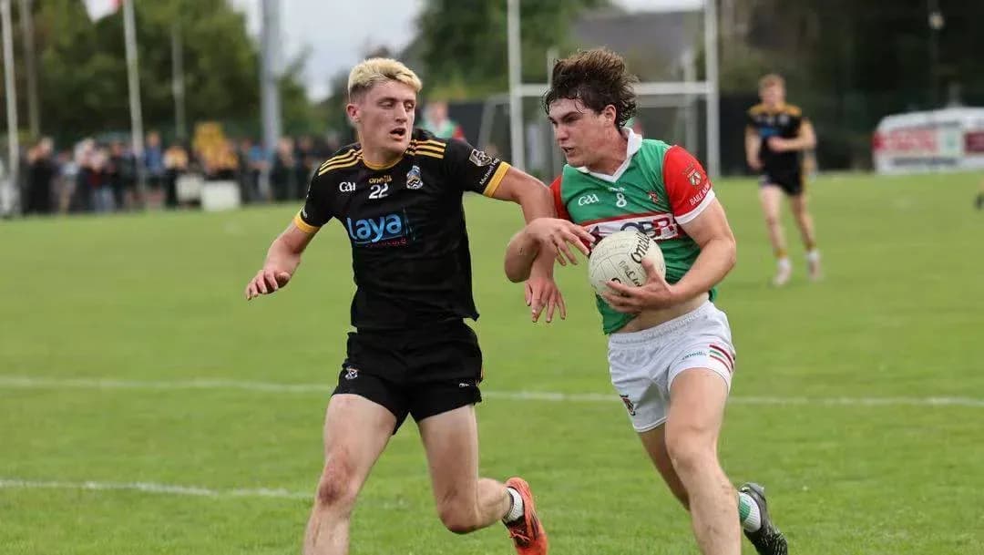 Two players competing for possession of the ball