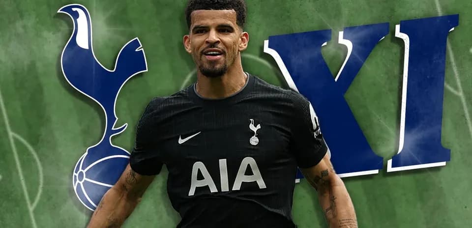 Tottenham player celebrating with team logo background