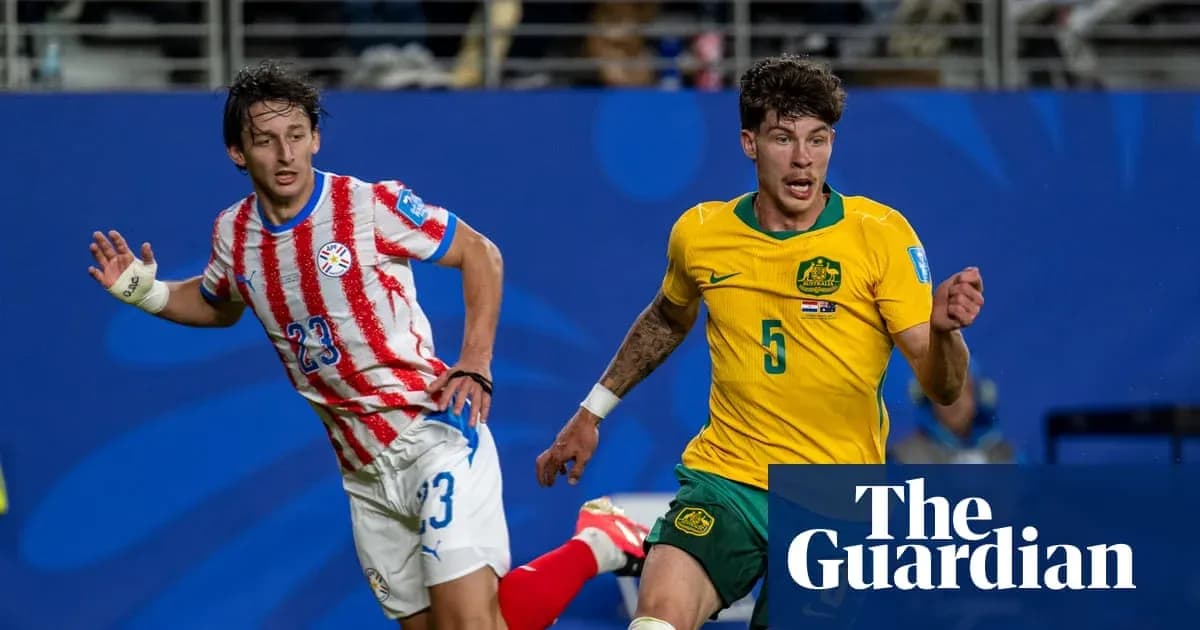 Players from Paraguay and Australia competing for the ball