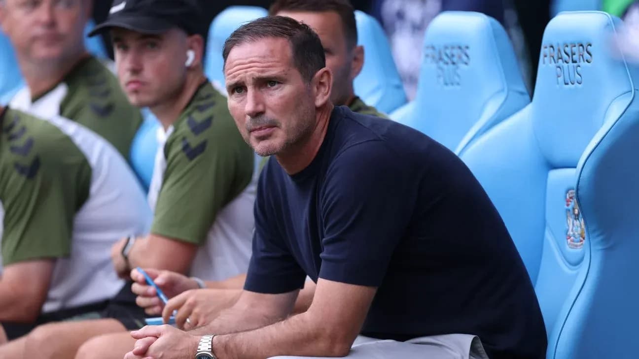 Coach sitting on bench during a match