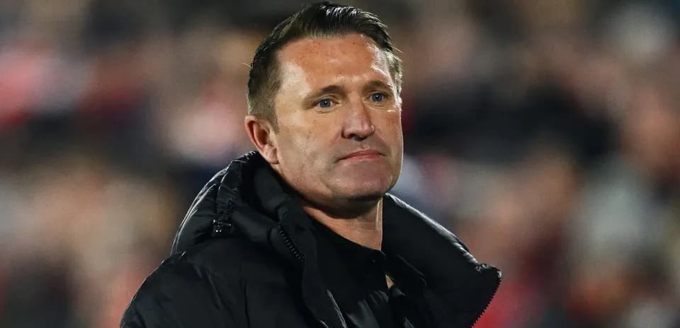 Football manager observing the match from sidelines