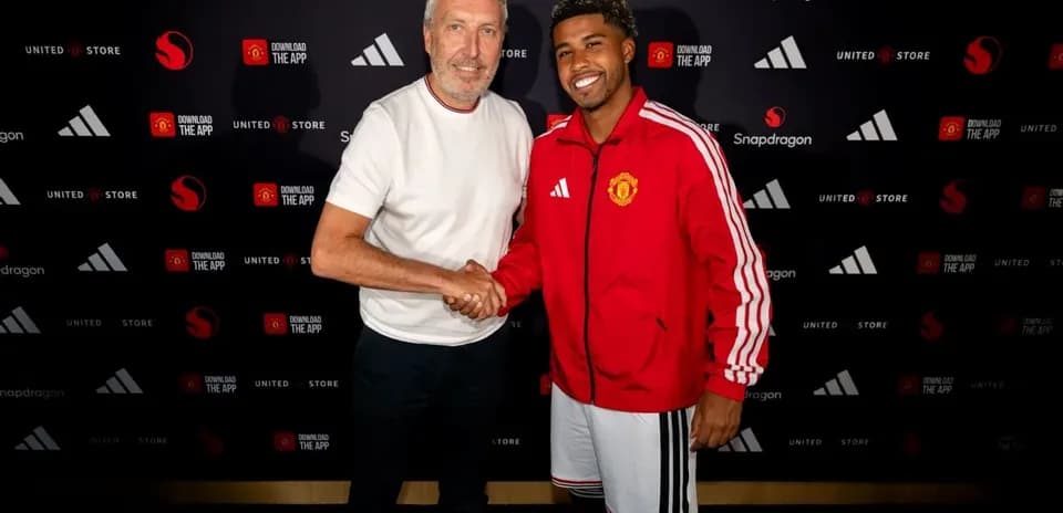 Two men shaking hands at a promotional event