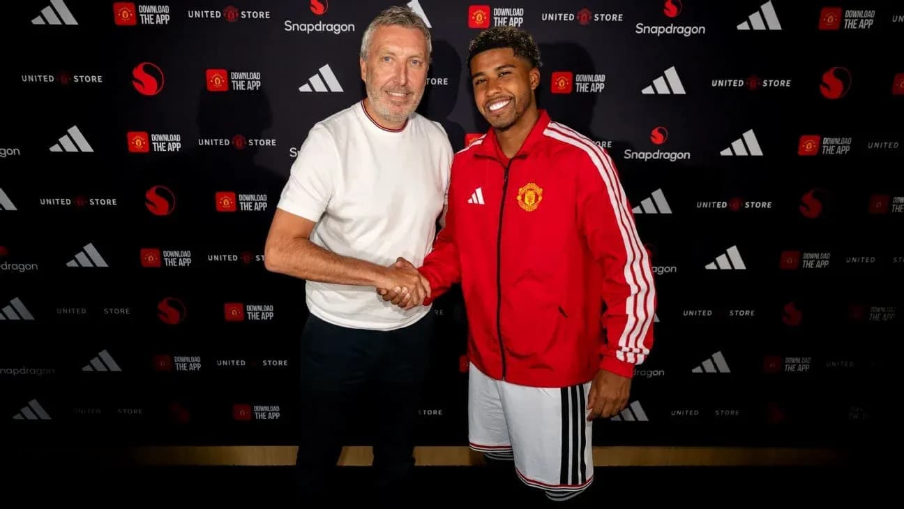 Two men shaking hands at a promotional event